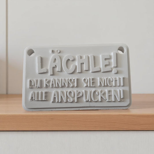 Schriftzug Lächle!